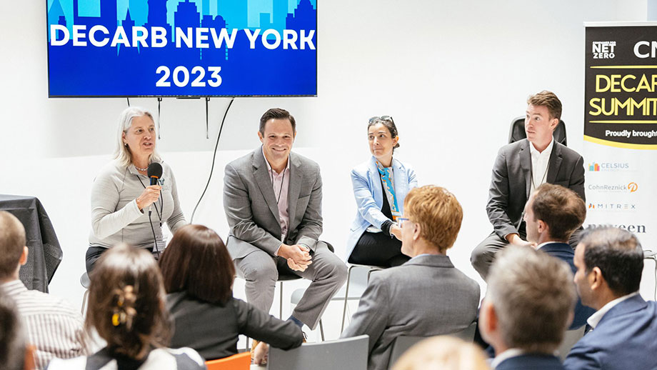 Chris Jones with panelists during a decarbonization summit in NYC