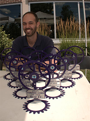 Farris at a local Team Konnect event with awards for participant innovation