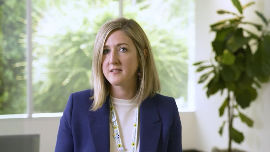 professional woman speaking in an office setting