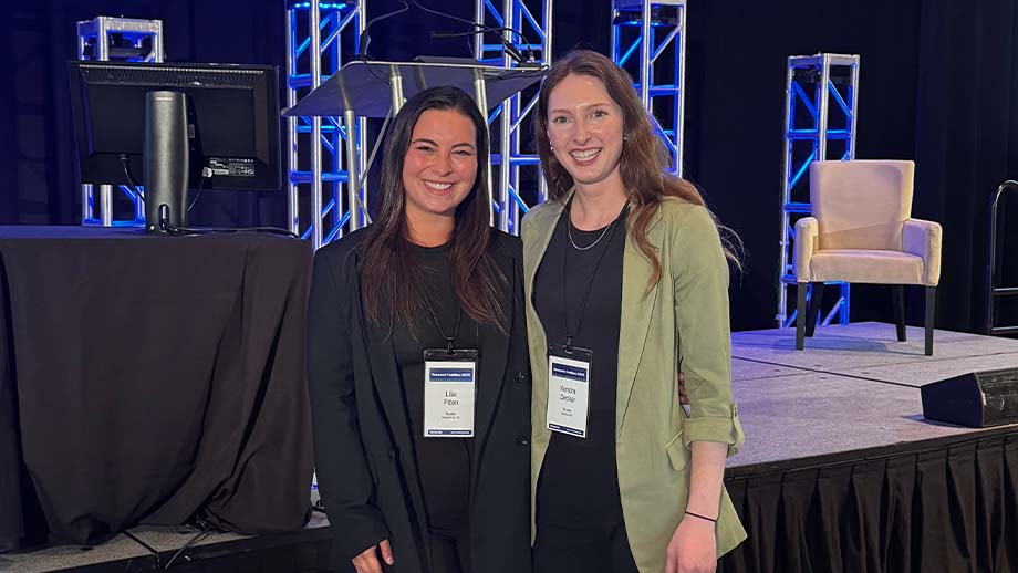 Kendra and a colleague at a tech conference