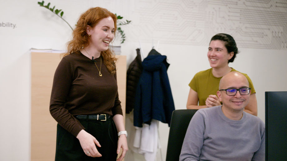 Laura collaborating with coworkers