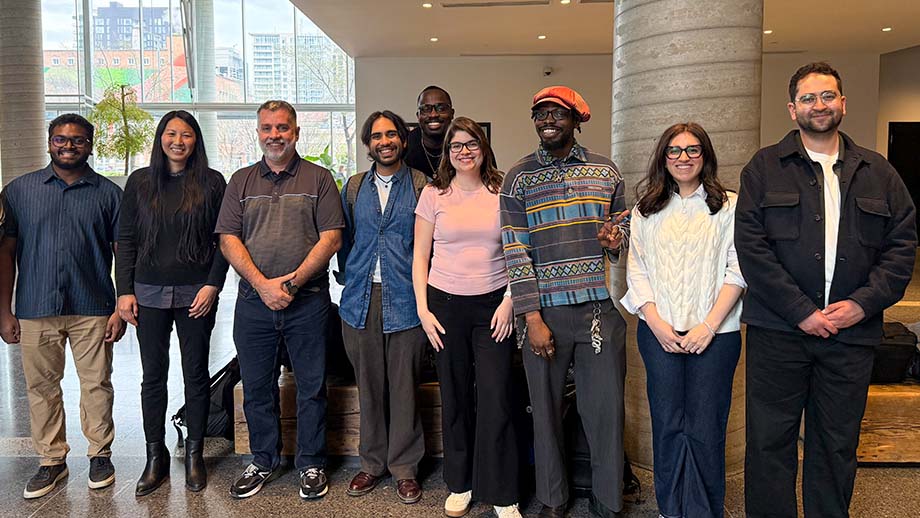 Leah standing with her colleagues