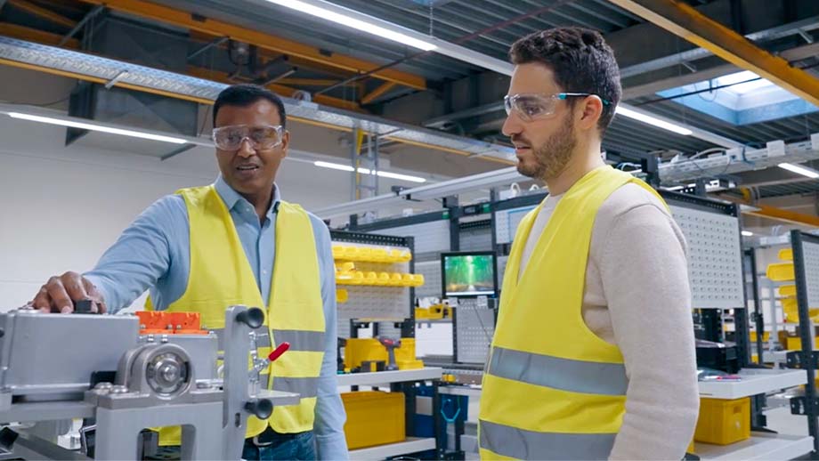 Sergio and colleague in manufacturing setting