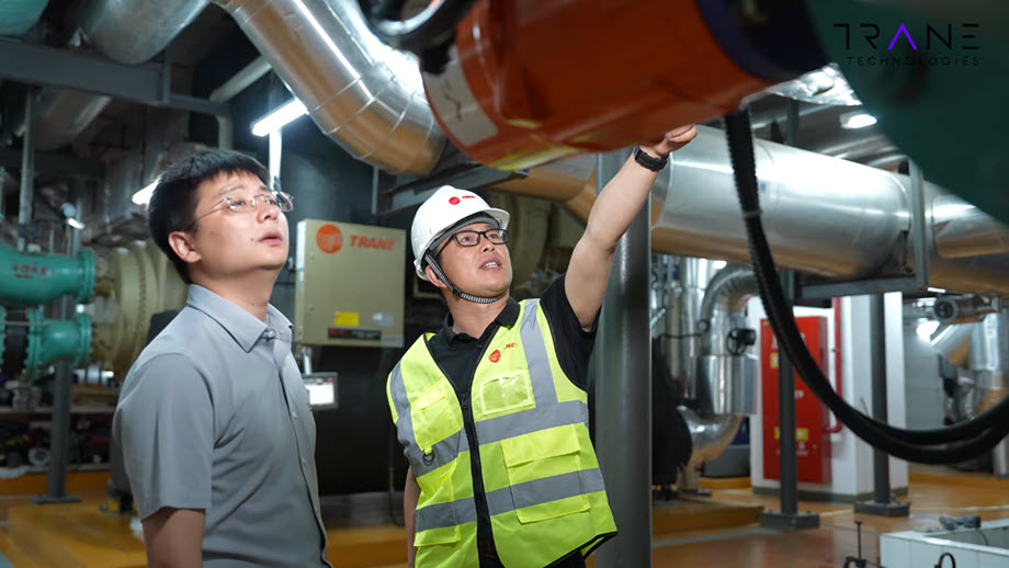 technicians inspecting industrial HVAC system